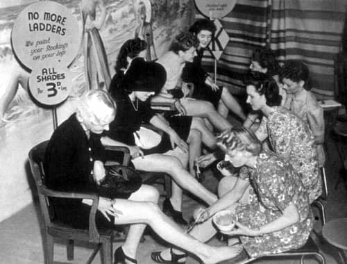 1941 Women having their legs painted in a British department store