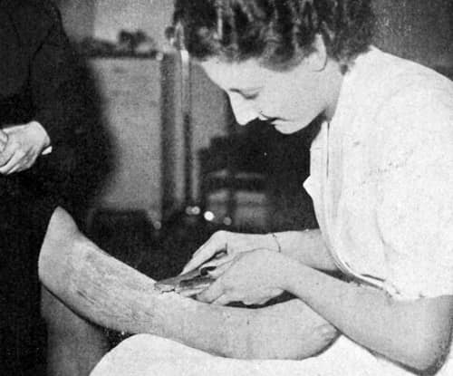 1937 Applying warmed Cire-Creme from a tube