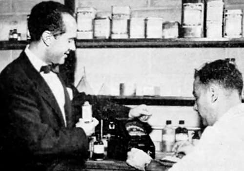 1954 Arnold Perlman inspecting cosmetics