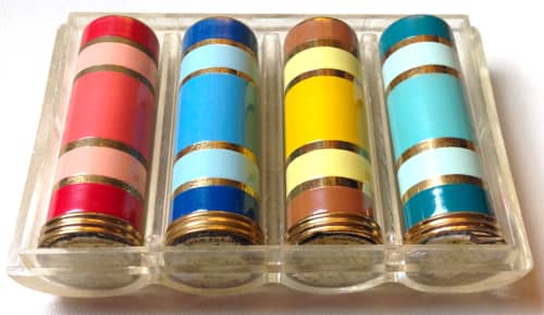 Four-Cast Lipsticks in a lucite container